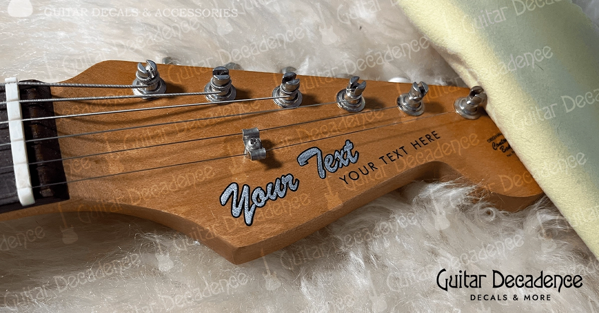 Waterslide Guitar Headstock Decal in Metallic Silver Ink on a natural wood finish electric guitar headstock.