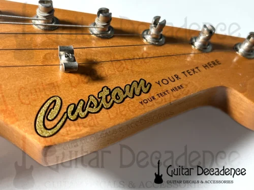 main listing picture for classic metallic gold screen printed decal on a stratocaster style headstock