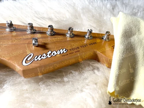 Close up of classic white guitar decal on a stratocaster style headstock